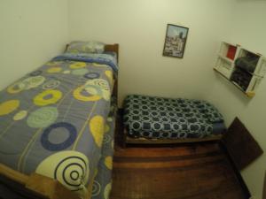 Postel nebo postele na pokoji v ubytování Lemuria Hostel