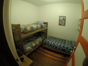 Postel nebo postele na pokoji v ubytování Lemuria Hostel