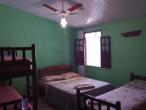 Postel nebo postele na pokoji v ubytování Pousada e Hostel Chapada Suites