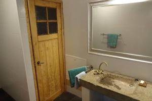 a bathroom with a sink and a mirror at Pont de Valenti Mountain Retreat in Girona +27 photos