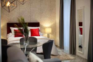 Posteľ alebo postele v izbe v ubytovaní Wanderlust Malaga Apartamentos 1