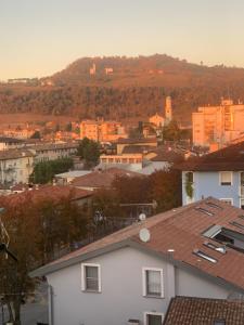 a view of a city with buildings and trees at Friuli Appartamenti in Cormòns