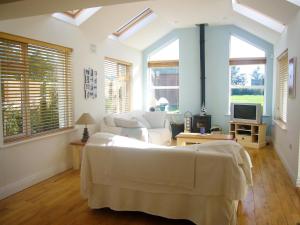 a living room with a bed and a couch at Dacha Holiday Home by Trident Holiday Homes in Ardmore