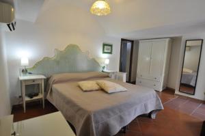 a bedroom with a bed with two pillows on it at Villa Eva in Anacapri