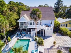 an aerial view of a house with a swimming pool at 114 W Huron - Sand Castle - Saltwater Pool - Heated upon request in Folly Beach