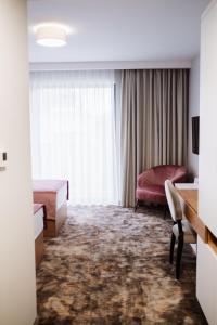Postel nebo postele na pokoji v ubytování Hotel Barcode Wellness & Spa