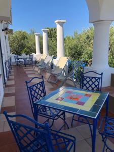 a blue table and chairs on a patio at Villa Eva in Anacapri