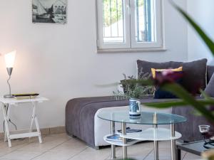 a living room with a couch and a table at Apartment Branka in Hvar