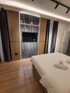 Katil atau katil-katil dalam bilik di Privilege Suites by Central Park