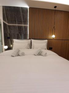 Katil atau katil-katil dalam bilik di Privilege Suites by Central Park