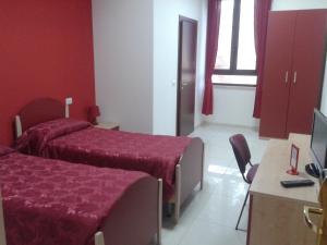 Voodi või voodid majutusasutuse Albergo Ma.Re toas