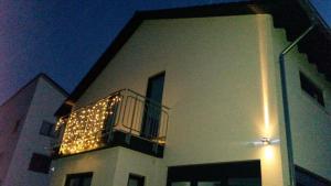 a building with a balcony with christmas lights on it at Gutunterdachgebracht in Langerwehe