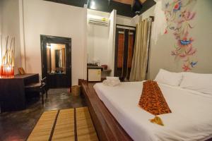 Ein Bett oder Betten in einem Zimmer der Unterkunft LaLaanta Hideaway Resort