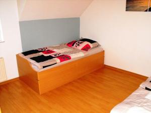 Ένα ή περισσότερα κρεβάτια σε δωμάτιο στο Ferienwohnung-Thielen-Waldrach-Ruwertal