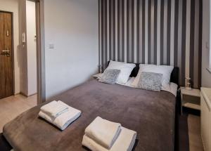 Postel nebo postele na pokoji v ubytování Apartament Kopydło