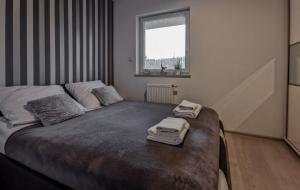 Postel nebo postele na pokoji v ubytování Apartament Kopydło