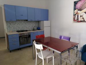 Kuchyň nebo kuchyňský kout v ubytování I Mirti - Home Holiday