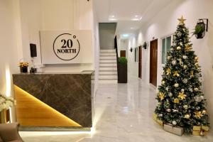 a christmas tree in the middle of a hallway at 20° North Hotel Mae Sai in Mae Sai