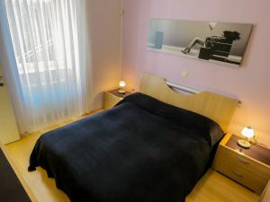 Postel nebo postele na pokoji v ubytování Apartment Palmic Lovran