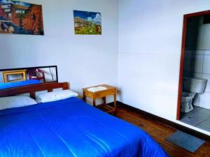 Giường trong phòng chung tại Hospedaje Nilton Huancayo