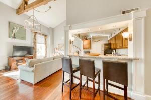 a kitchen and living room with a couch and a table at 195 East Bay in Charleston