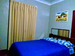 سرير أو أسرّة في غرفة في Hospedaje Nilton Huancayo