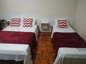 En eller flere senge i et værelse på Pax Hotel , próximo da 25 de Março, Brás, Bom Retiro e República