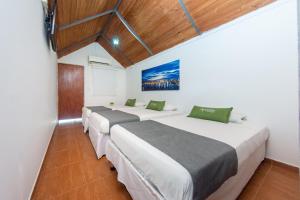 Postel nebo postele na pokoji v ubytování Hotel Ayenda Casa Cano 1805