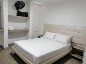 Postel nebo postele na pokoji v ubytování Hotel 42 Avenida