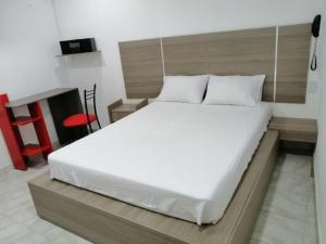 Postel nebo postele na pokoji v ubytování Hotel 42 Avenida