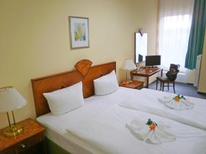 Katil atau katil-katil dalam bilik di Hotel Amadeus Central
