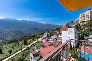 a view from a balcony of a city with mountains at Mega View Homestay in Sapa