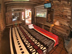 TV a/nebo společenská místnost v ubytování Hotel Cabaña Los Ruiseñores