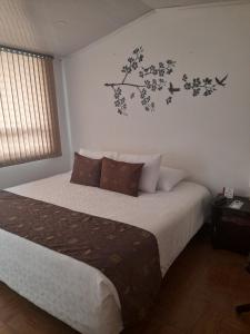 Postel nebo postele na pokoji v ubytování Hotel Confort Bogota + 20 fotografií