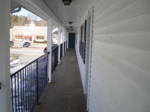 a hallway of a house with a balcony at Sunset Inn in Lee