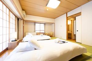 Säng eller sängar i ett rum på Phoenix Hotel by Hakuba Hospitality Group