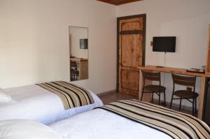 Cama o camas de una habitación en Paihuen Lodge