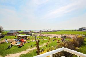 a park with a playground with slides and play equipment at Buedlfarm-Sued in Sahrensdorf