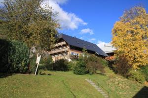 a large building with a yard in front of it at Alter-Kaiserhof in Bernau im Schwarzwald