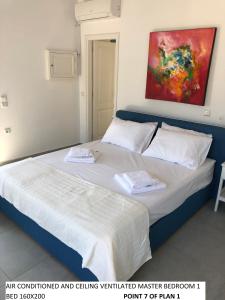 Postel nebo postele na pokoji v ubytování Aegean Dream 1