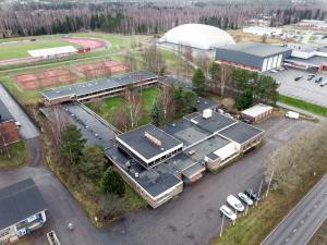 an aerial view of a building with a parking lot at Budget Hotel Raahe in Raahe