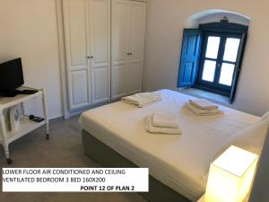 Postel nebo postele na pokoji v ubytování Aegean Dream 1