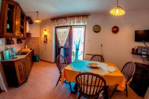 a kitchen with a table and chairs in a room at Beautiful-Banjole-Beachside-Apartment-A1-150m-from-the-beach in Banjole