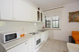 Kuchyň nebo kuchyňský kout v ubytování Apartments Omo 1