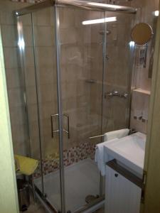 a bathroom with a shower and a sink at Allgaeublick-App23-Gaestehaus-in-Bad-Hindelang in Bad Hindelang