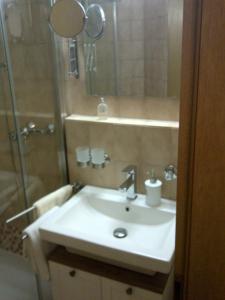 a bathroom with a sink and a shower at Allgaeublick-App23-Gaestehaus-in-Bad-Hindelang in Bad Hindelang