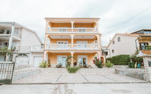 an image of a house with a balcony at Apartments Vukic in Crikvenica