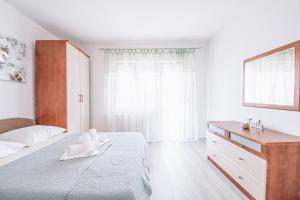 Postel nebo postele na pokoji v ubytování Apartments Vukic