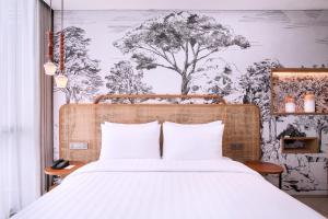 Postelja oz. postelje v sobi nastanitve Mercure Tangerang BSD City