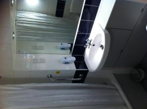 a bathroom with a toilet and a sink at Days Inn Hotel Abington - Glasgow in Abington